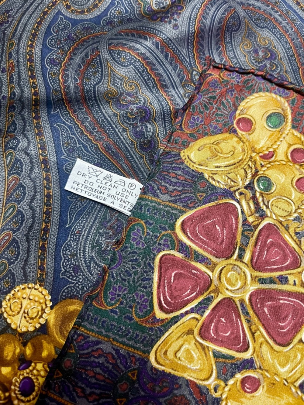CHANEL Silk Scarf – Ornate Gold Chain & Jewel Motif on Deep Navy — luxury scarf rolled edge detail
