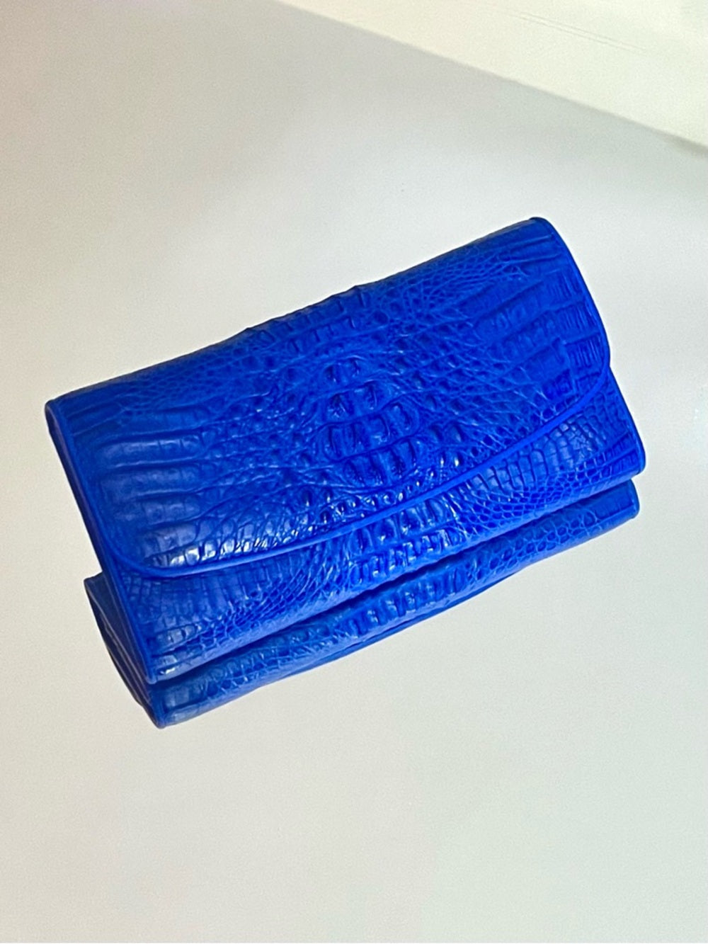 Genuine Crocodile Skin Clutch – Vibrant Blue Exotic Leather Foldover Clutch — natural leather grain and texture closeup