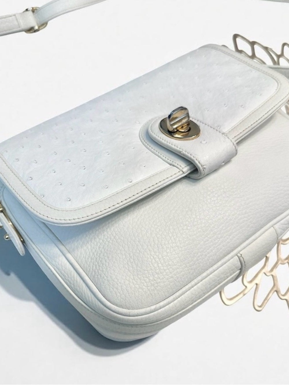 Gucci White Ostrich & Leather Vintage Crossbody Bag Gold GG Turnlock Flap — designer logo branding and craftsmanship