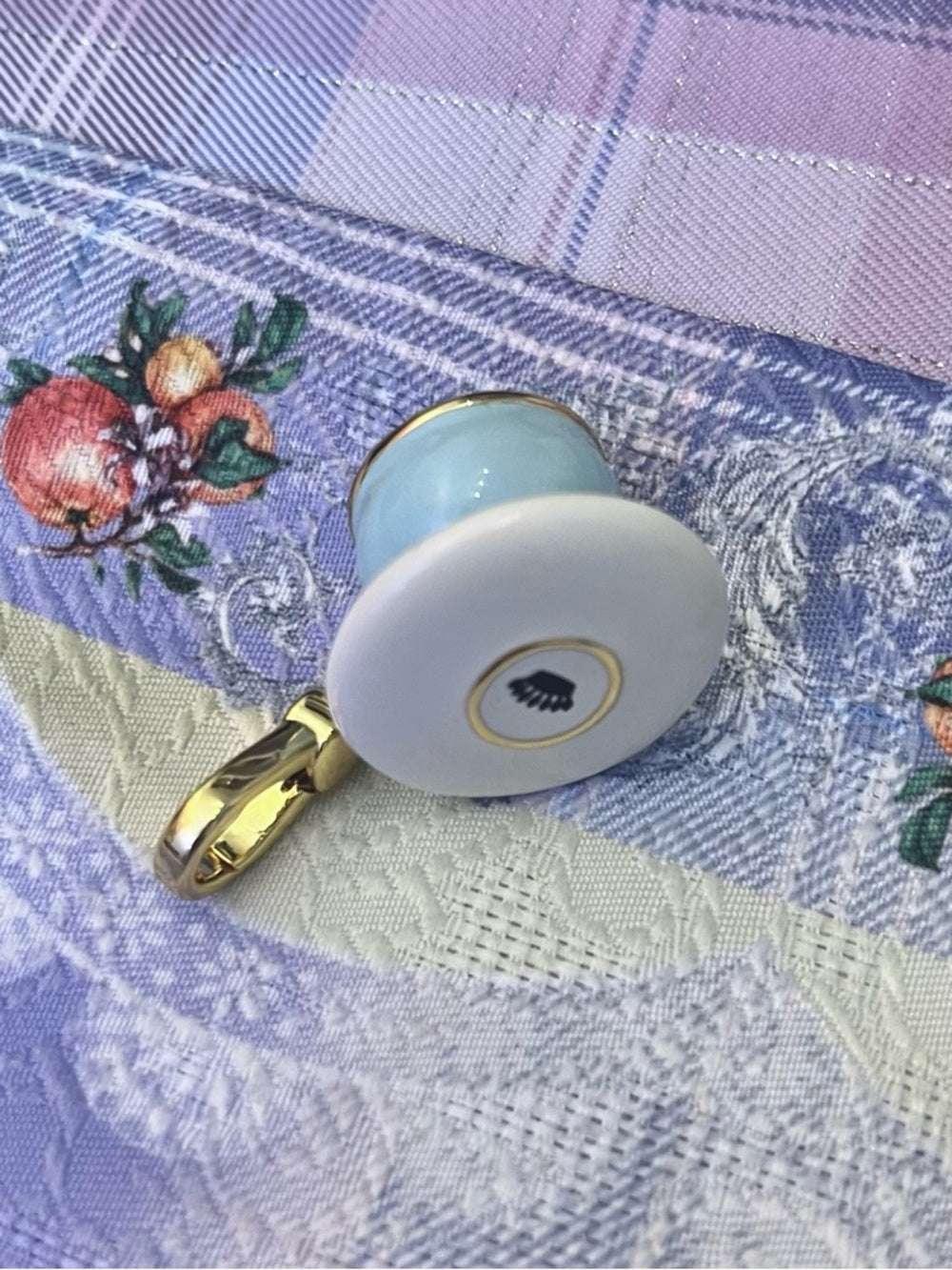 Juicy Couture blue teacup charm with gold trim and crystal halo — miniature charm figurine color detail