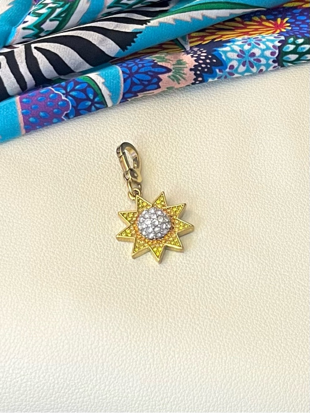 Juicy Couture Gold Starburst Crystal Charm - Yellow, Orange and Clear Pave — charm back logo and branding detail