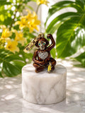 Juicy Couture Monkey Charm – Green Jeweled Eyes & Crystal Heart — front view with green jeweled eyes