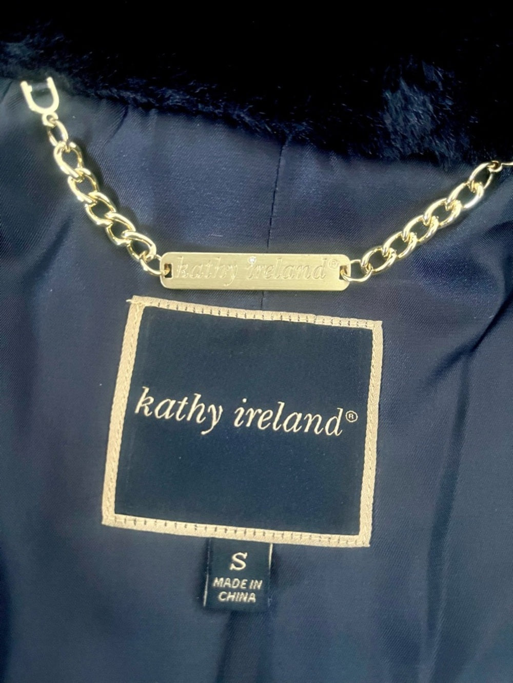 kathy ireland Black Faux Fur Open-Front Teddy Jacket Size Small NWT — designer branding and logo closeup